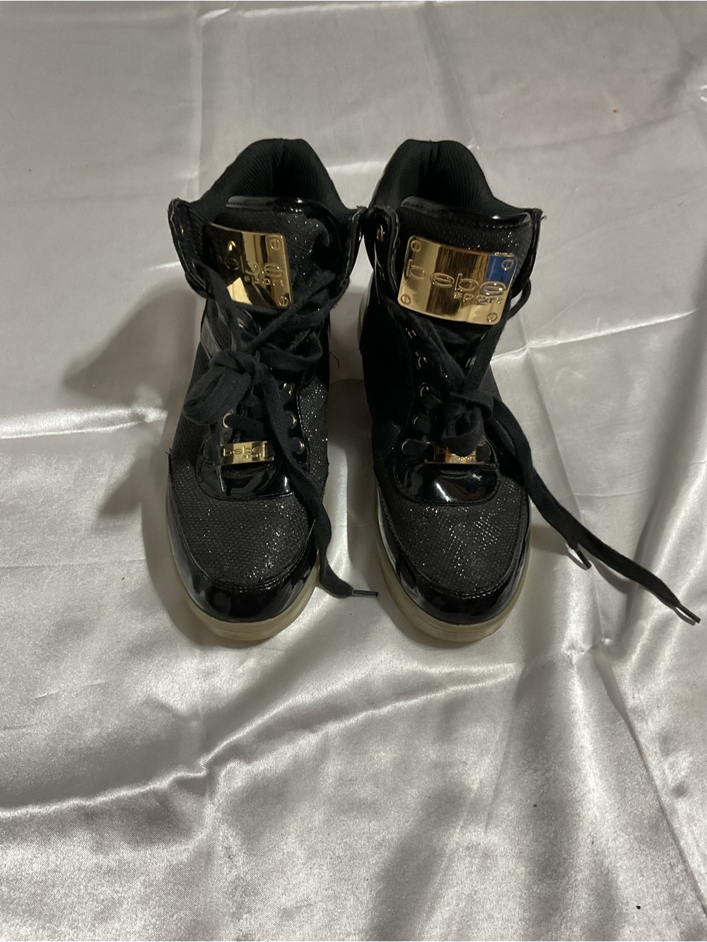 bebe Black Lace-Up Wedge Boots with Gold Plate